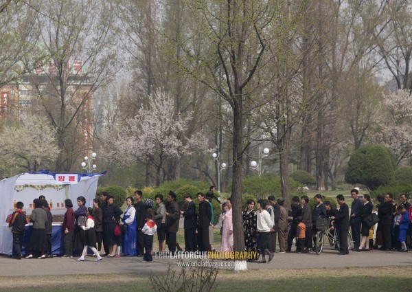 North Korean people queuing to buy some food in a small shop, Pyongan Province, Pyongyang, North Korea