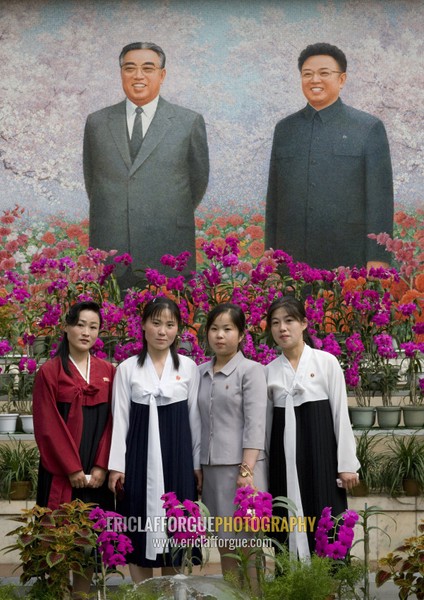 North Korean women posing in the international Kimilsungia and Kimjongilia festival, Pyongan Province, Pyongyang, North Korea