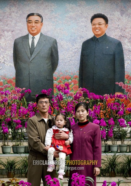 North Korean family posing in the international Kimilsungia and Kimjongilia festival, Pyongan Province, Pyongyang, North Korea