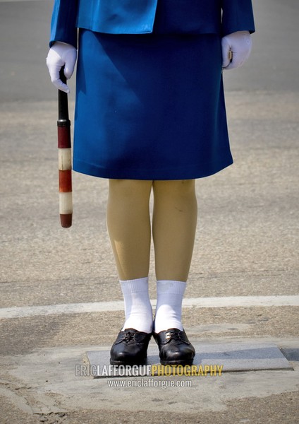 North Korean traffic security officer in blue uniform in the street, Pyongan Province, Pyongyang, North Korea