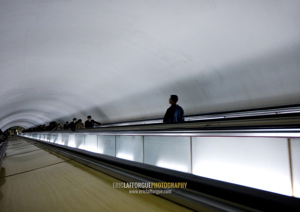 North Korean people using escalator leading to the subway station, Pyongan Province, Pyongyang, North Korea