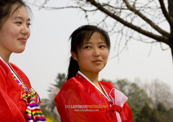 Two North Korean young women in choson-ot in a park, Pyongan Province, Pyongyang, North Korea