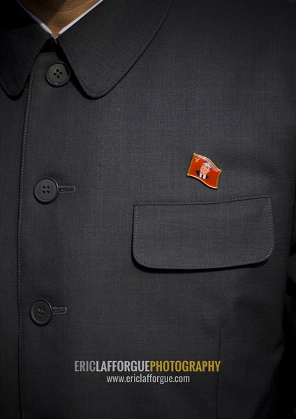 Kim il Sung pin on a man suit, Pyongan Province, Pyongyang, North Korea