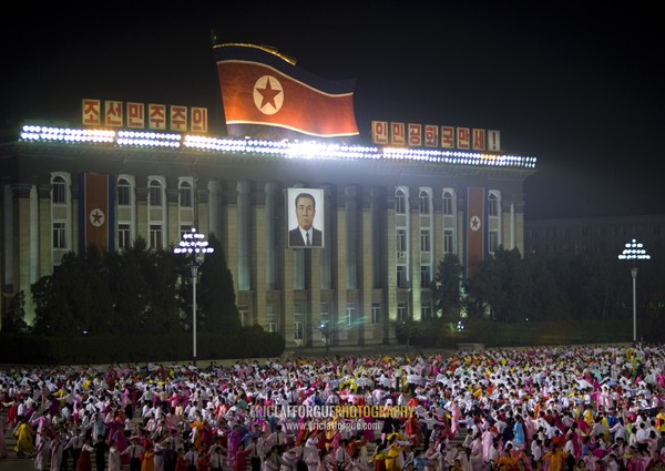 North Korean students dancing to celebrate april 15 the birth anniversary of Kim Il-sung on Kim il Sung square, Pyongan Province, Pyongyang, North Korea