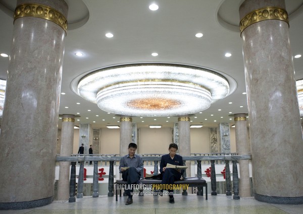 North Korean men reading in the hall of the Grand people's study house, Pyongan Province, Pyongyang, North Korea