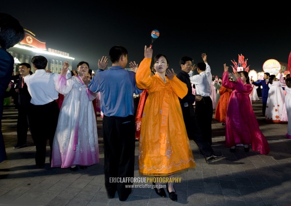 North Korean students dancing to celebrate april 15 the birth anniversary of Kim Il-sung on Kim il Sung square, Pyongan Province, Pyongyang, North Korea