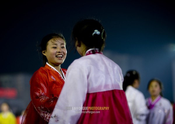 North Korean students dancing to celebrate april 15 the birth anniversary of Kim Il-sung on Kim il Sung square, Pyongan Province, Pyongyang, North Korea