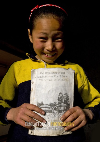 North Korean girl holding an english class book, Kangwon Province, Chonsam Cooperative Farm, North Korea