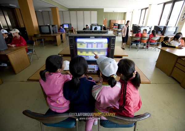 North Korean children playing video games in Songdowon international children's camp, Kangwon Province, Wonsan, North Korea