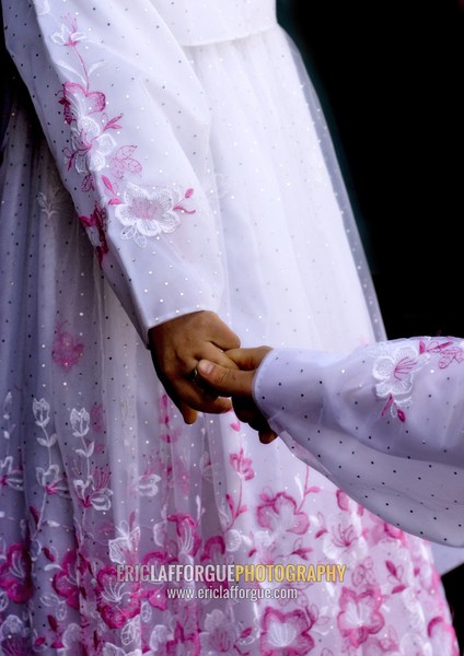 North Korean women in choson-ot holding hands, Kangwon Province, Wonsan, North Korea