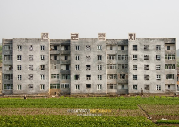 Building with propaganda slogan on the top, North Hwanghae Province, Kaesong, North Korea