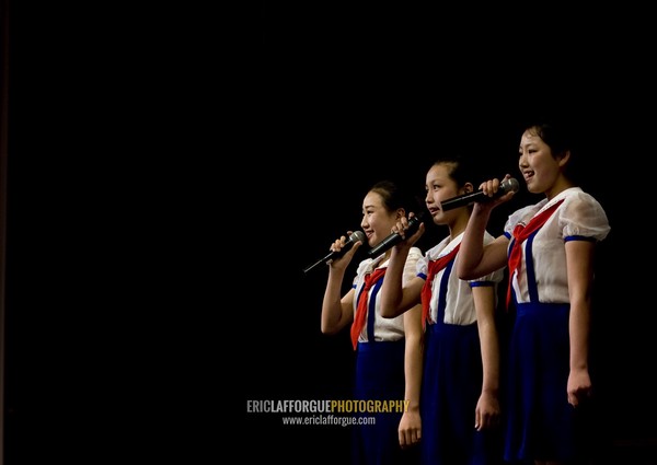 North Korean pioneers girls singing in Mangyongdae children's palace, Pyongan Province, Pyongyang, North Korea