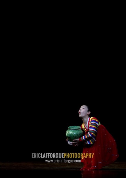 North Korean acrobat girl with a pottery on the stage of Mangyongdae children's palace, Pyongan Province, Pyongyang, North Korea