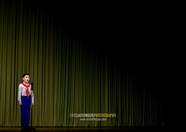 North Korean boy on the stage of Mangyongdae children's palace, Pyongan Province, Pyongyang, North Korea