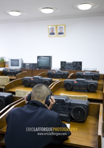 North Korean man listening to music in the multimedia room of the Grand people's study house, Pyongan Province, Pyongyang, North Korea