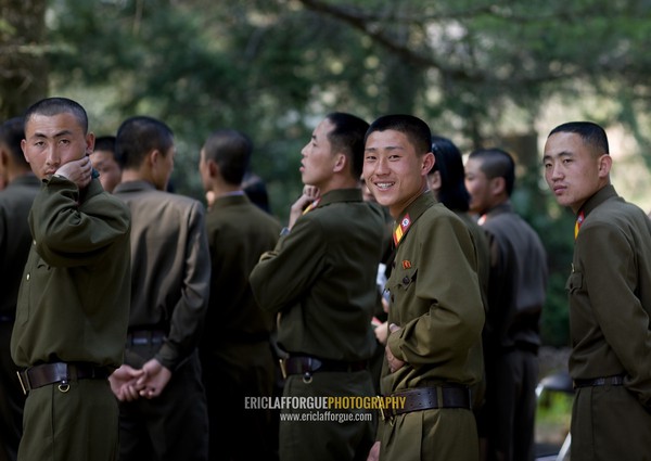 Smiling North Korean soldiers in the street, Hyangsan county, Mount Myohyang, North Korea