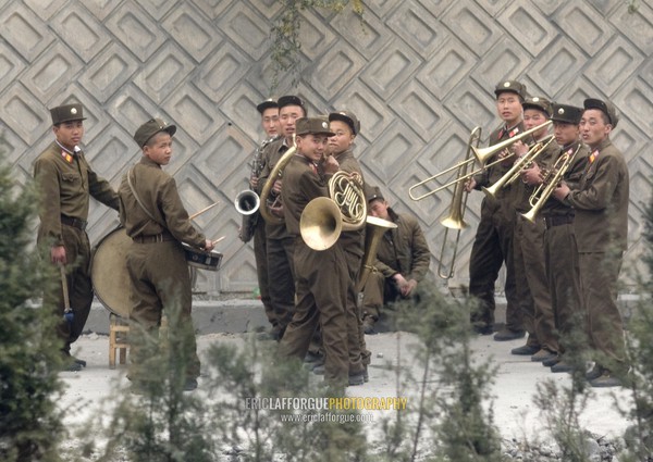 Military brass band on a highway playing for the North Korean workers, Pyongan Province, Pyongyang, North Korea