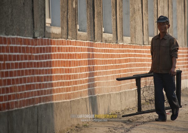 North Korean worker walking in the street, North Hwanghae Province, Kaesong, North Korea