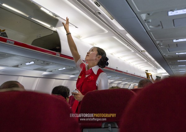 Flight attendant inside an air Koryo tupolev plane, Pyongan Province, Pyongyang, North Korea