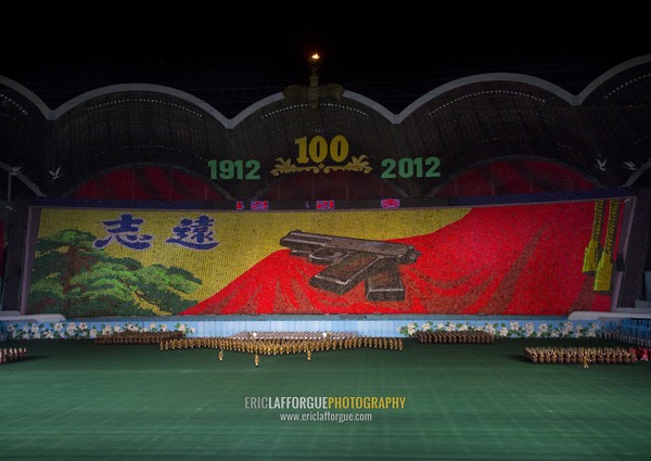 Kim il Sung pistol made by human pixels holding up colored boards during Arirang mass games in may day stadium, Pyongan Province, Pyongyang, North Korea