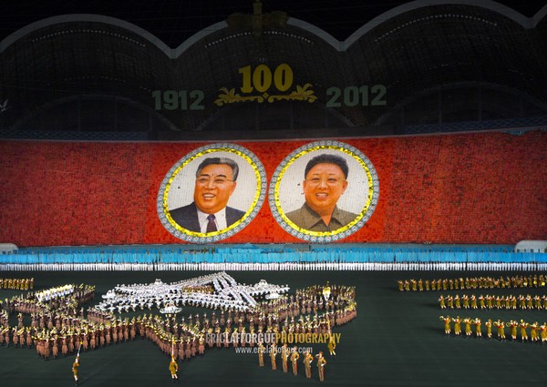 Kim il Sung and Kim Jong il portraits made by children pixels holding up colored boards during Arirang mass games in may day stadium, Pyongan Province, Pyongyang, North Korea