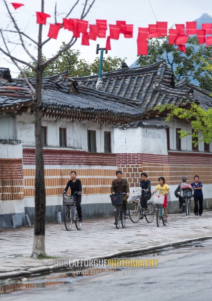 North Korean people with bicycles in the old streets, North Hwanghae Province, Kaesong, North Korea