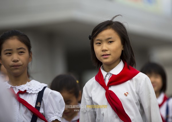 North Korean pioneers going to pay respect to the Dear Leaders at Mansudae art studio, Pyongan Province, Pyongyang, North Korea