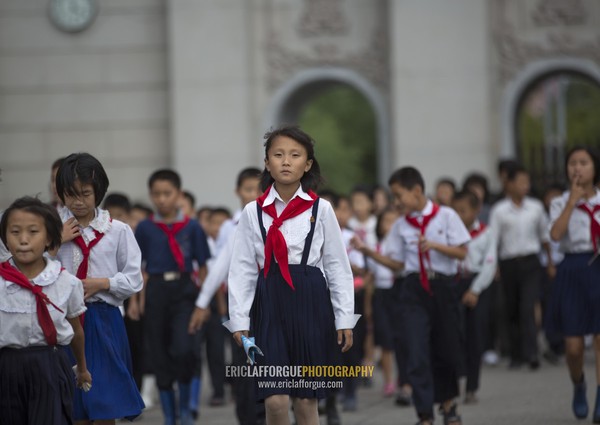 North Korean pioneers going to pay respect to the Dear Leaders at Mansudae art studio, Pyongan Province, Pyongyang, North Korea