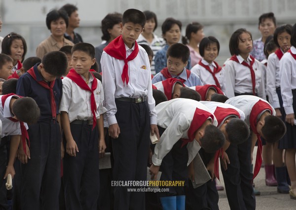 North Korean pioneers going to pay respect to the Dear Leaders at Mansudae art studio, Pyongan Province, Pyongyang, North Korea