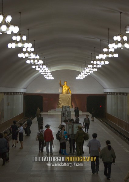 North Korean people reading the offical state newspaper in Kaeson metro station, Pyongan Province, Pyongyang, North Korea