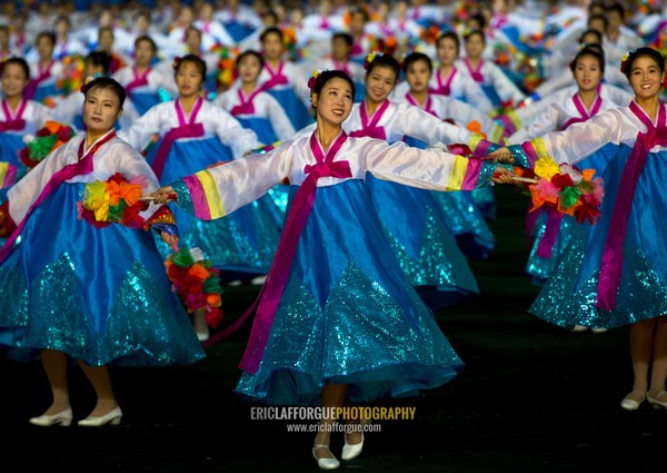 North Korean women dancing in choson-ot during the Arirang mass games in may day stadium, Pyongan Province, Pyongyang, North Korea