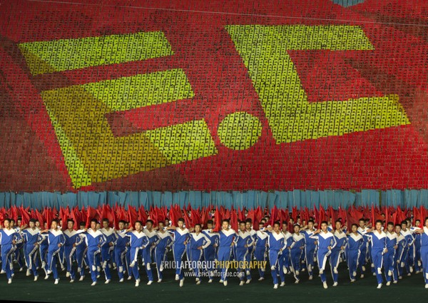 Anti capitalism human fresco made by children pixels holding up colored boards during Arirang mass games in may day stadium, Pyongan Province, Pyongyang, North Korea