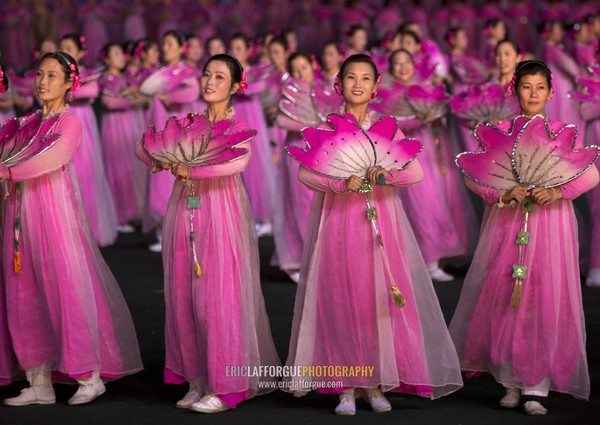 North Korean women dancing in choson-ot during the Arirang mass games in may day stadium, Pyongan Province, Pyongyang, North Korea