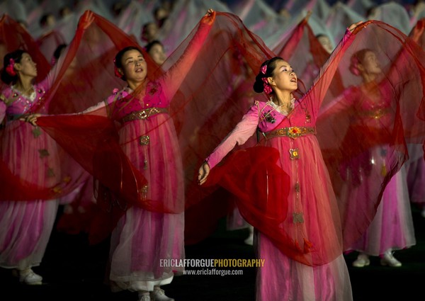 North Korean women dancing in choson-ot during the Arirang mass games in may day stadium, Pyongan Province, Pyongyang, North Korea