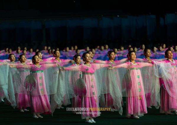 North Korean women dancing in choson-ot during the Arirang mass games in may day stadium, Pyongan Province, Pyongyang, North Korea