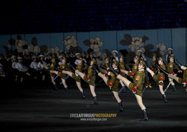 Sexy North Korean women dressed as soldiers dancing with swords during the Arirang mass games in may day stadium, Pyongan Province, Pyongyang, North Korea