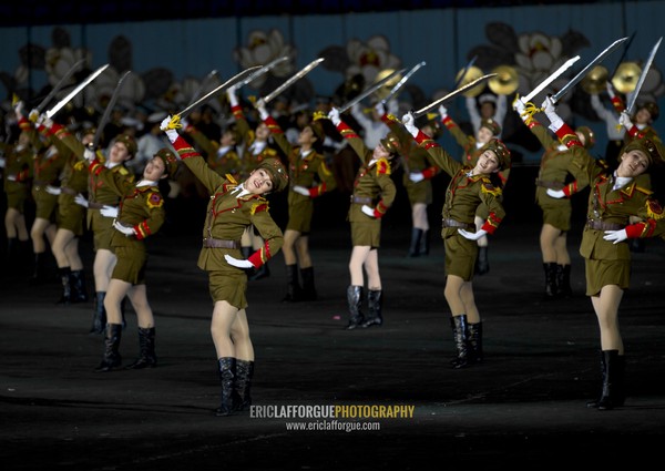 Sexy North Korean women dressed as soldiers dancing with swords during the Arirang mass games in may day stadium, Pyongan Province, Pyongyang, North Korea