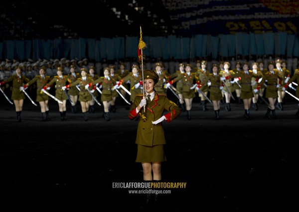 Sexy North Korean women dressed as soldiers dancing with swords during the Arirang mass games in may day stadium, Pyongan Province, Pyongyang, North Korea