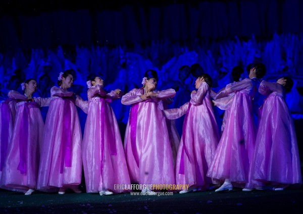 North Korean women dancing in choson-ot during the Arirang mass games in may day stadium, Pyongan Province, Pyongyang, North Korea