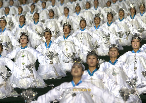 North Korean women dancing in choson-ot during the Arirang mass games in may day stadium, Pyongan Province, Pyongyang, North Korea