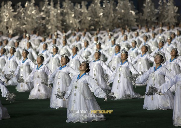 North Korean women dancing in choson-ot during the Arirang mass games in may day stadium, Pyongan Province, Pyongyang, North Korea