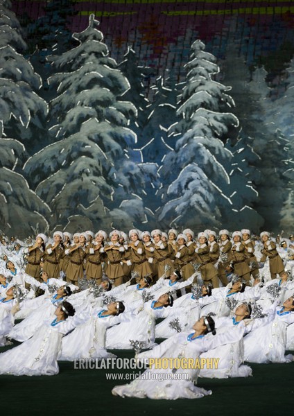 North Korean women dressed as soldiers and dancers in a forest during the Arirang mass games at may day stadium, Pyongan Province, Pyongyang, North Korea