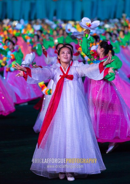 North Korean women dancing in choson-ot during the Arirang mass games in may day stadium, Pyongan Province, Pyongyang, North Korea