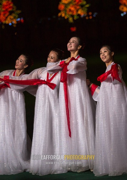 North Korean women dancing in choson-ot during the Arirang mass games in may day stadium, Pyongan Province, Pyongyang, North Korea