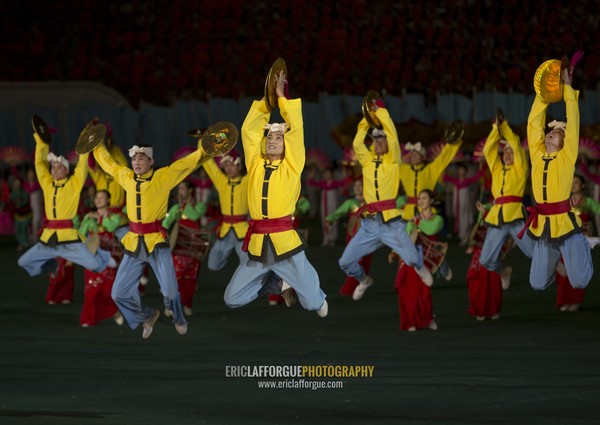 North Korean acrobats jumping at Arirang mass games in may day stadium, Pyongan Province, Pyongyang, North Korea