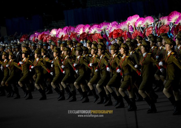 North Korean women dressed as soldiers during the Arirang mass games in may day stadium, Pyongan Province, Pyongyang, North Korea