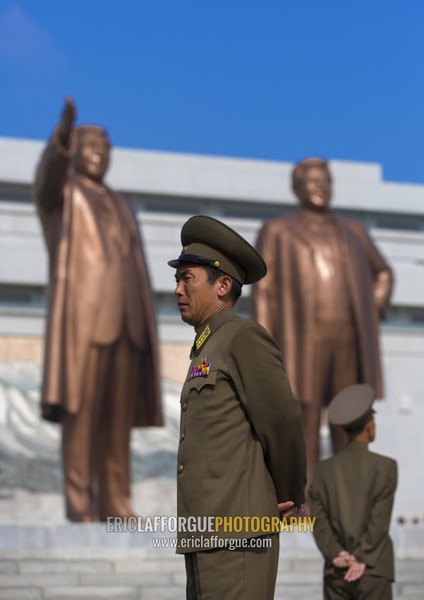 North Korean soldiers in front of the two statues of the Dear Leaders in the Grand monument on Mansu hill, Pyongan Province, Pyongyang, North Korea