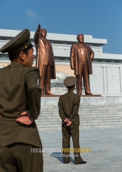 North Korean soldiers in front of the statues of the Dear Leaders in Mansudae Grand monument, Pyongan Province, Pyongyang, North Korea