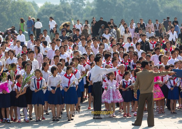 North Korean pioneers from the Korean children's union in the Grand monument on Mansu hill, Pyongan Province, Pyongyang, North Korea