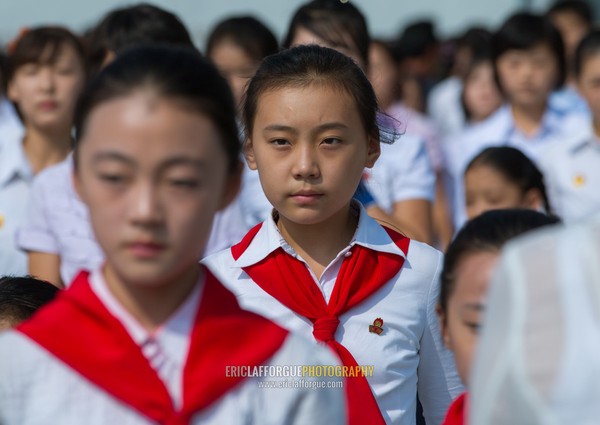 North Korean pioneers girls in the Grand monument on Mansu hill, Pyongan Province, Pyongyang, North Korea